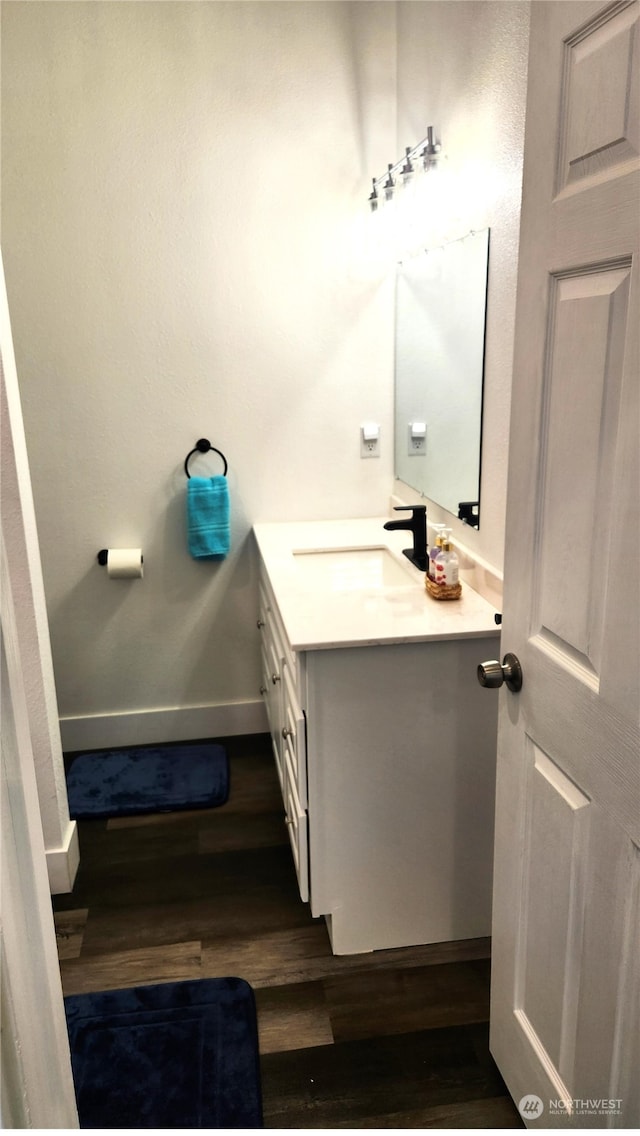 bathroom featuring vanity and wood-type flooring