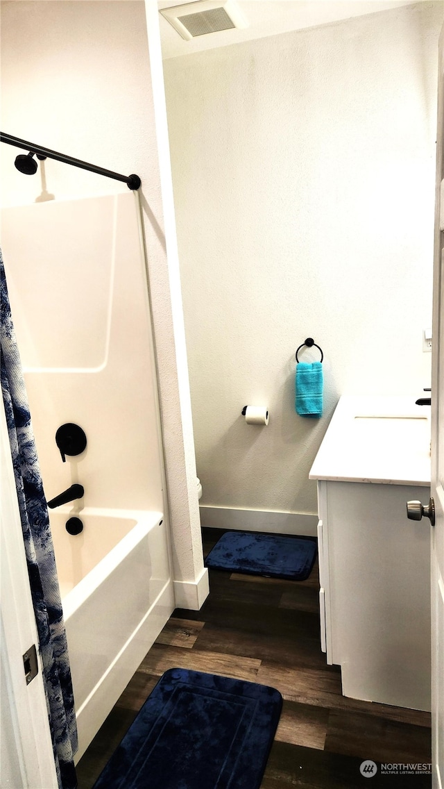 bathroom featuring vanity, shower / tub combo, and hardwood / wood-style floors