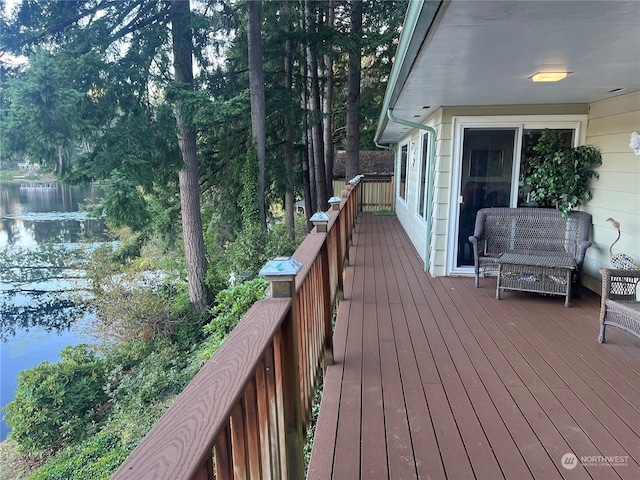 wooden terrace with a water view