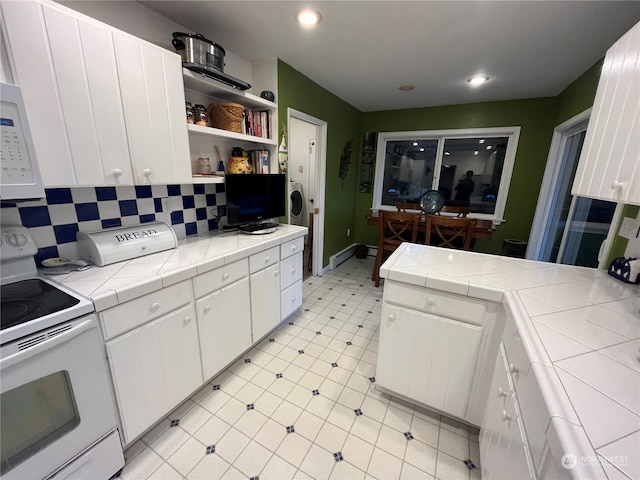 kitchen with tile counters, white appliances, white cabinetry, and tasteful backsplash