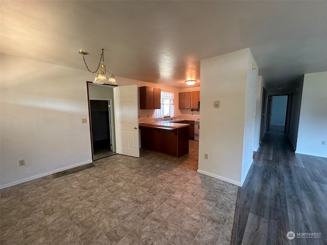 kitchen with vaulted ceiling, hardwood / wood-style floors, and sink