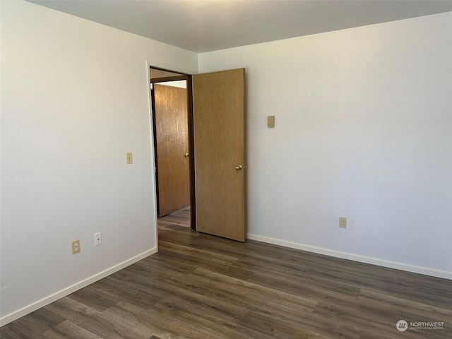 empty room featuring dark hardwood / wood-style floors