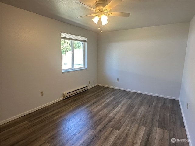 spare room featuring a baseboard heating unit, dark hardwood / wood-style flooring, and ceiling fan