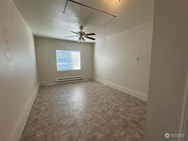 spare room with baseboard heating and ceiling fan