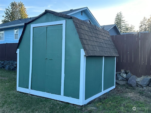 view of outbuilding with a yard