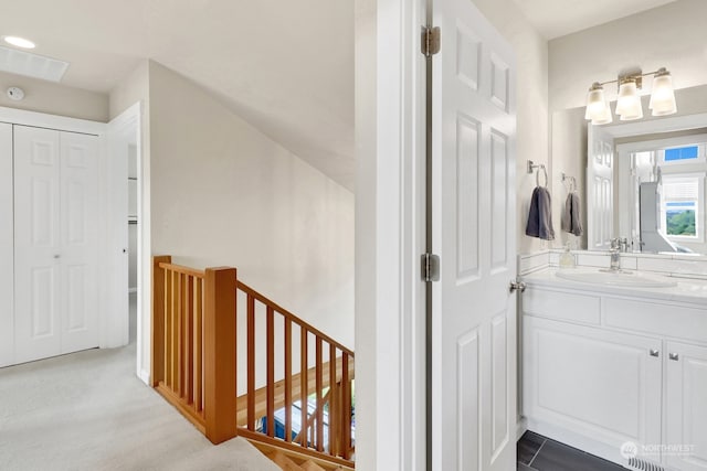 interior space with light carpet and sink