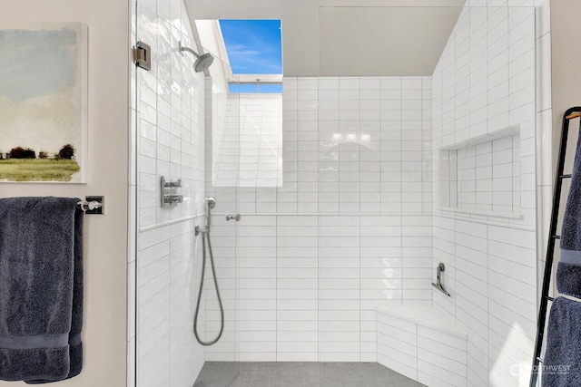 bathroom with a tile shower