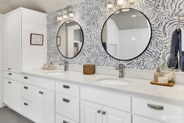 bathroom with vanity and vaulted ceiling