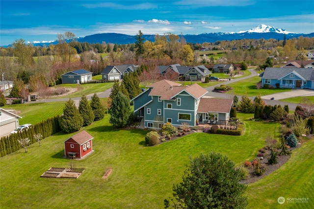 birds eye view of property featuring a mountain view