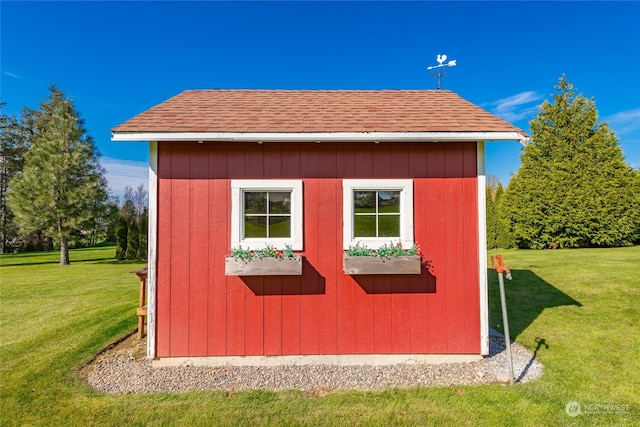 view of outdoor structure with a lawn