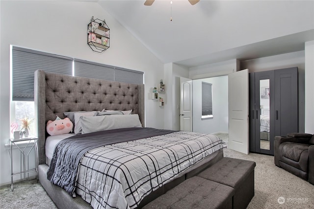 carpeted bedroom with high vaulted ceiling and ceiling fan