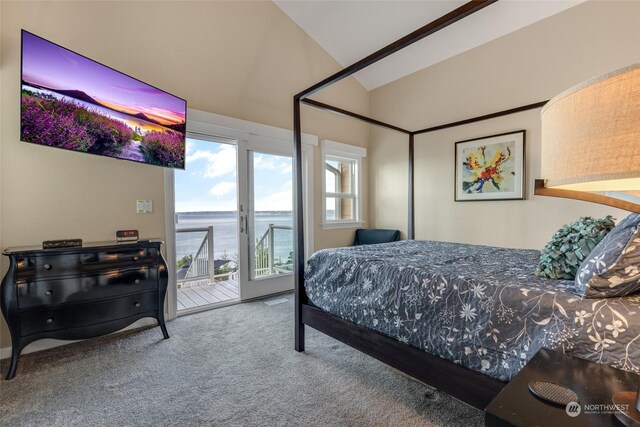 bedroom with carpet floors, access to outside, and vaulted ceiling