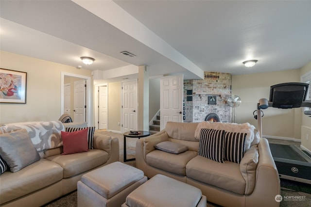 carpeted living room with stairway, a fireplace, visible vents, and baseboards