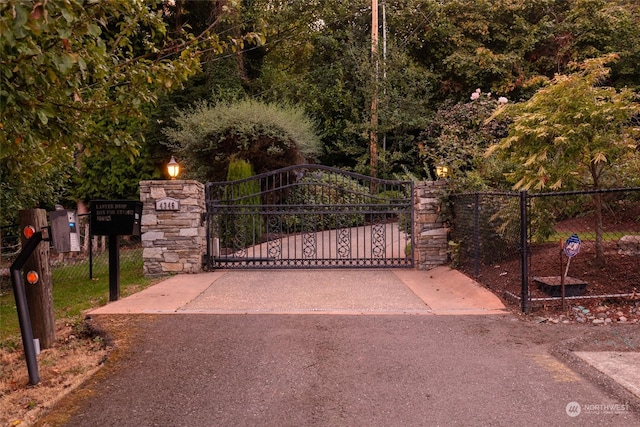 view of gate with fence