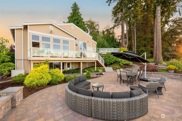 exterior space with an outdoor hangout area and a patio area