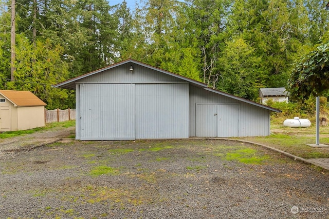 view of pole building featuring fence