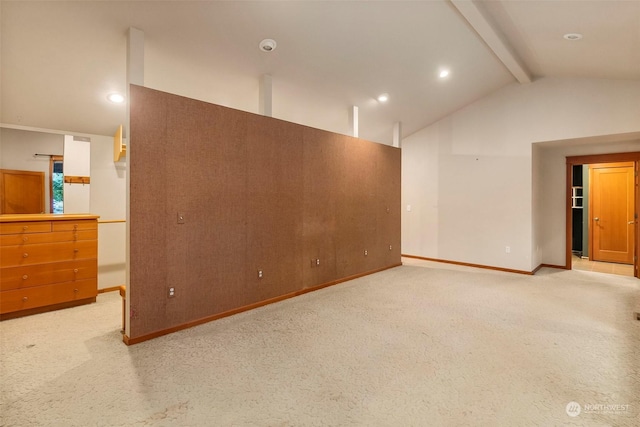 unfurnished room featuring lofted ceiling with beams, recessed lighting, baseboards, and light colored carpet