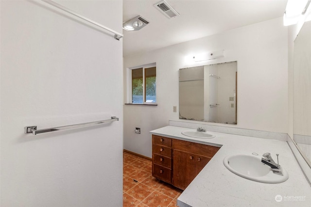 full bathroom with tile patterned flooring, visible vents, and vanity