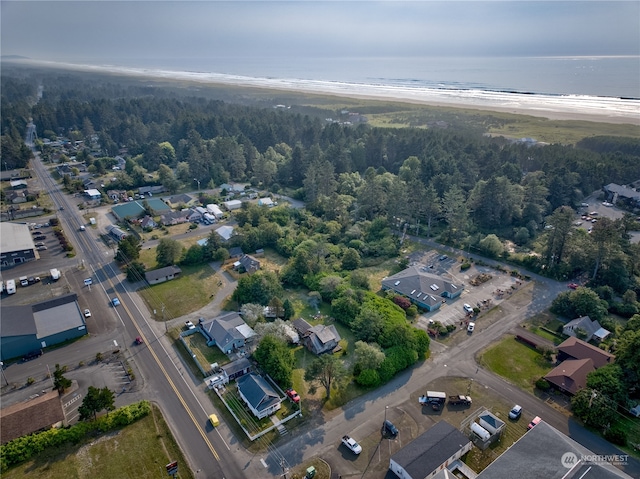 bird's eye view featuring a beach view and a water view