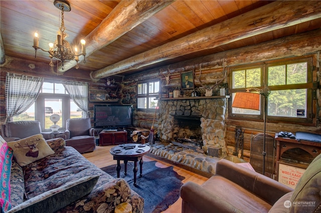 living room with a fireplace, hardwood / wood-style floors, an inviting chandelier, wood ceiling, and beam ceiling