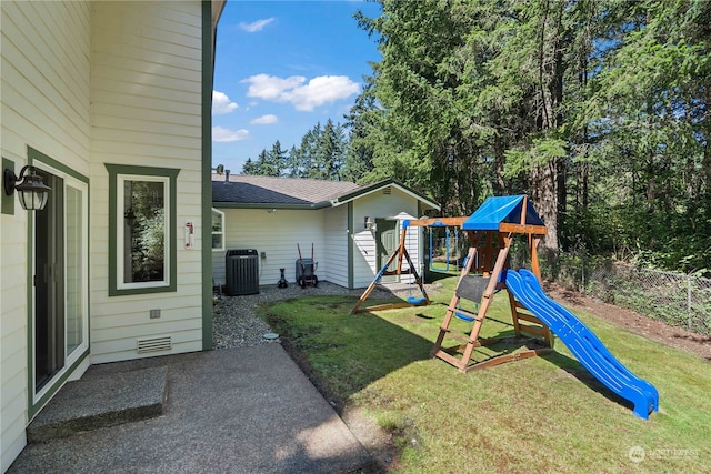 view of playground featuring central AC and a yard