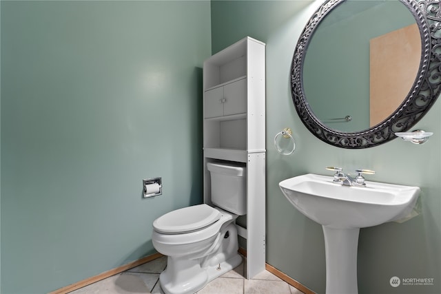 bathroom with toilet and tile patterned floors