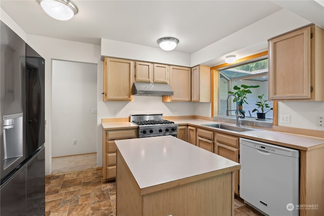 kitchen with stainless steel range oven, a kitchen island, white dishwasher, sink, and black fridge