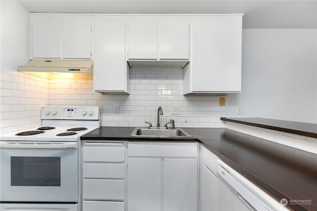 kitchen with white appliances, white cabinetry, sink, and tasteful backsplash