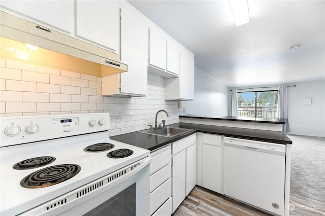 kitchen with white cabinets, white appliances, sink, wood-type flooring, and tasteful backsplash