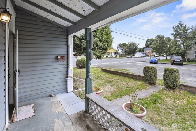 view of patio featuring a residential view and a porch