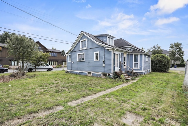 view of front of home with a front lawn