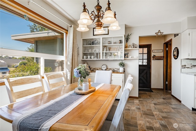 dining room with a notable chandelier