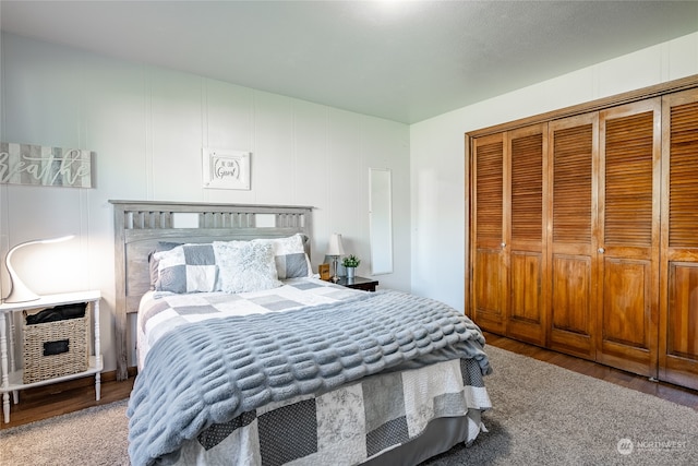 bedroom featuring a closet and hardwood / wood-style flooring