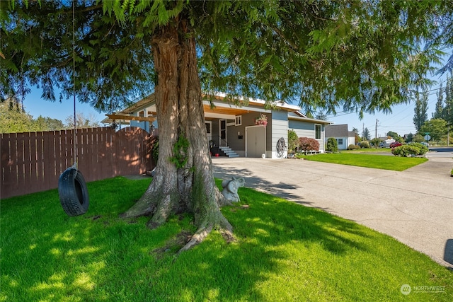 ranch-style house with a carport and a front yard