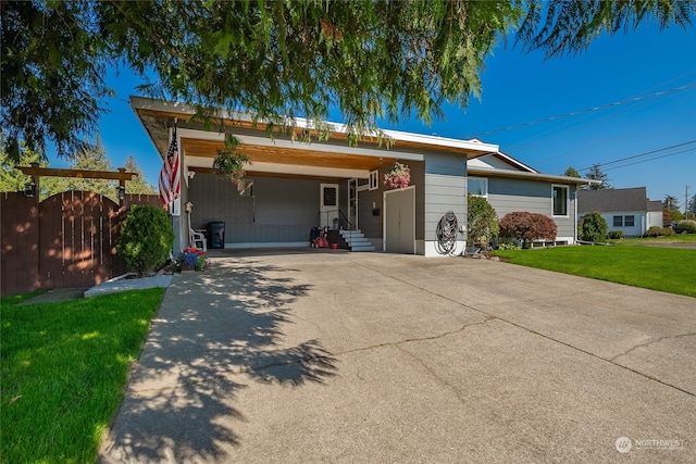 ranch-style house with a front lawn and a carport