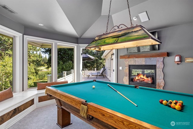 game room with pool table, visible vents, carpet flooring, vaulted ceiling, and a multi sided fireplace