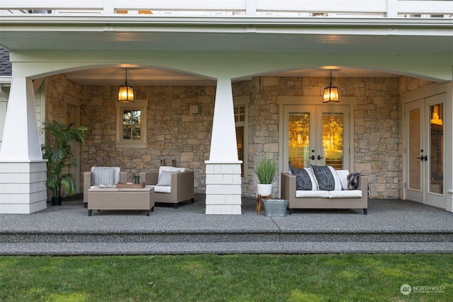 view of patio with covered porch, french doors, and an outdoor living space