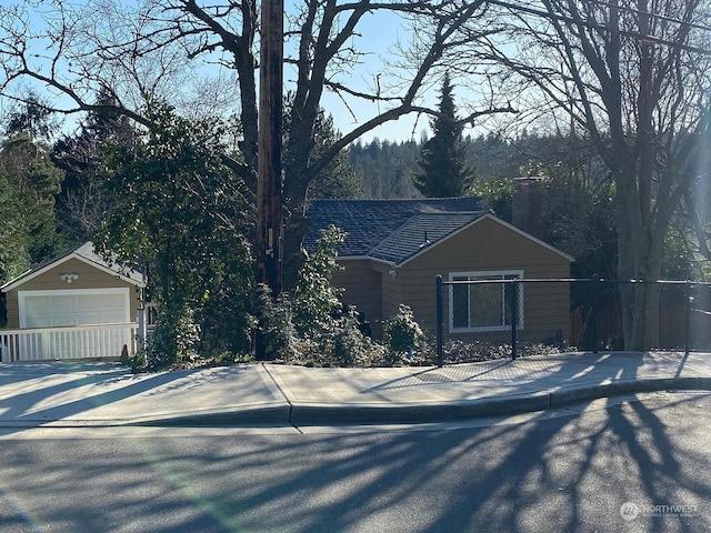 view of front of home with an outbuilding and a garage