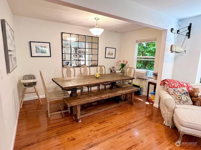 dining space featuring light wood-type flooring