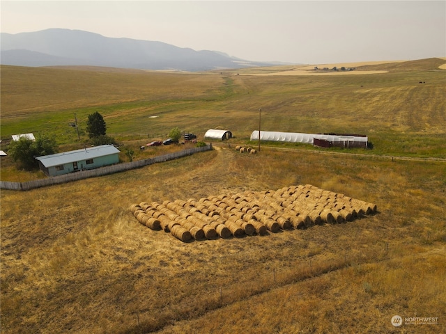 aerial view with a mountain view and a rural view