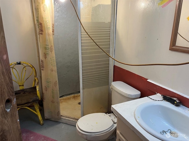 full bathroom with concrete flooring, a stall shower, vanity, and toilet