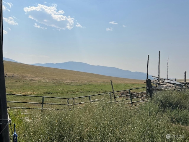 mountain view featuring a rural view