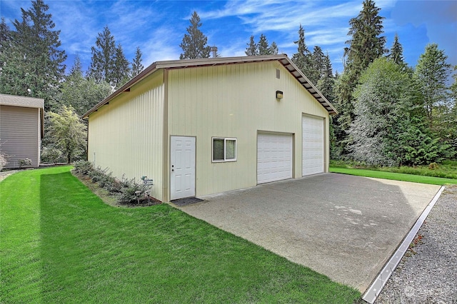 garage featuring a lawn