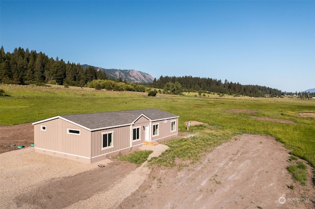 birds eye view of property with a rural view and a mountain view