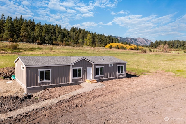 view of front of house with a rural view