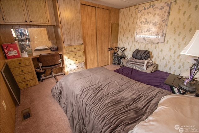 bedroom featuring a closet and light carpet