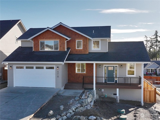 view of front of home featuring a garage and covered porch