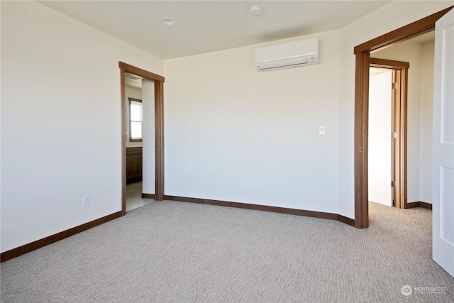 empty room with light colored carpet and a wall mounted AC