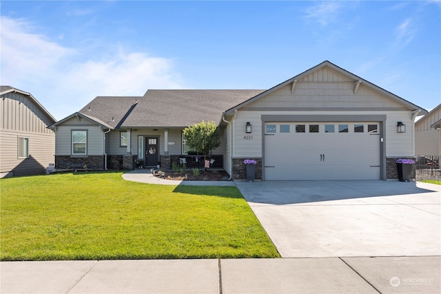 view of front of property featuring a garage and a front lawn