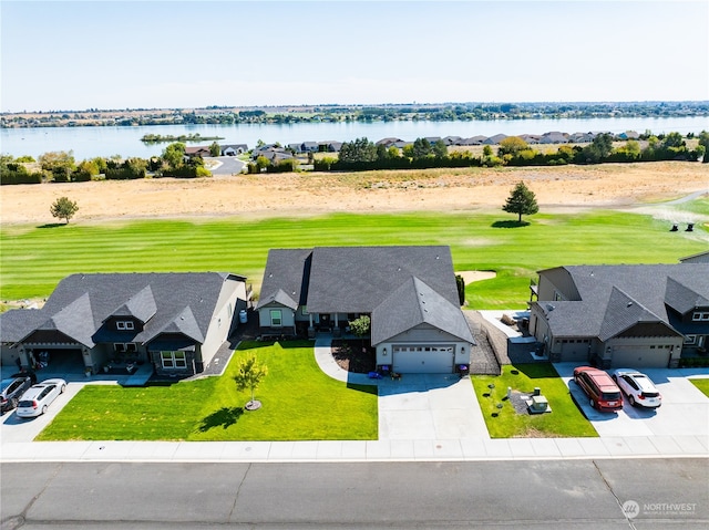 birds eye view of property with a water view